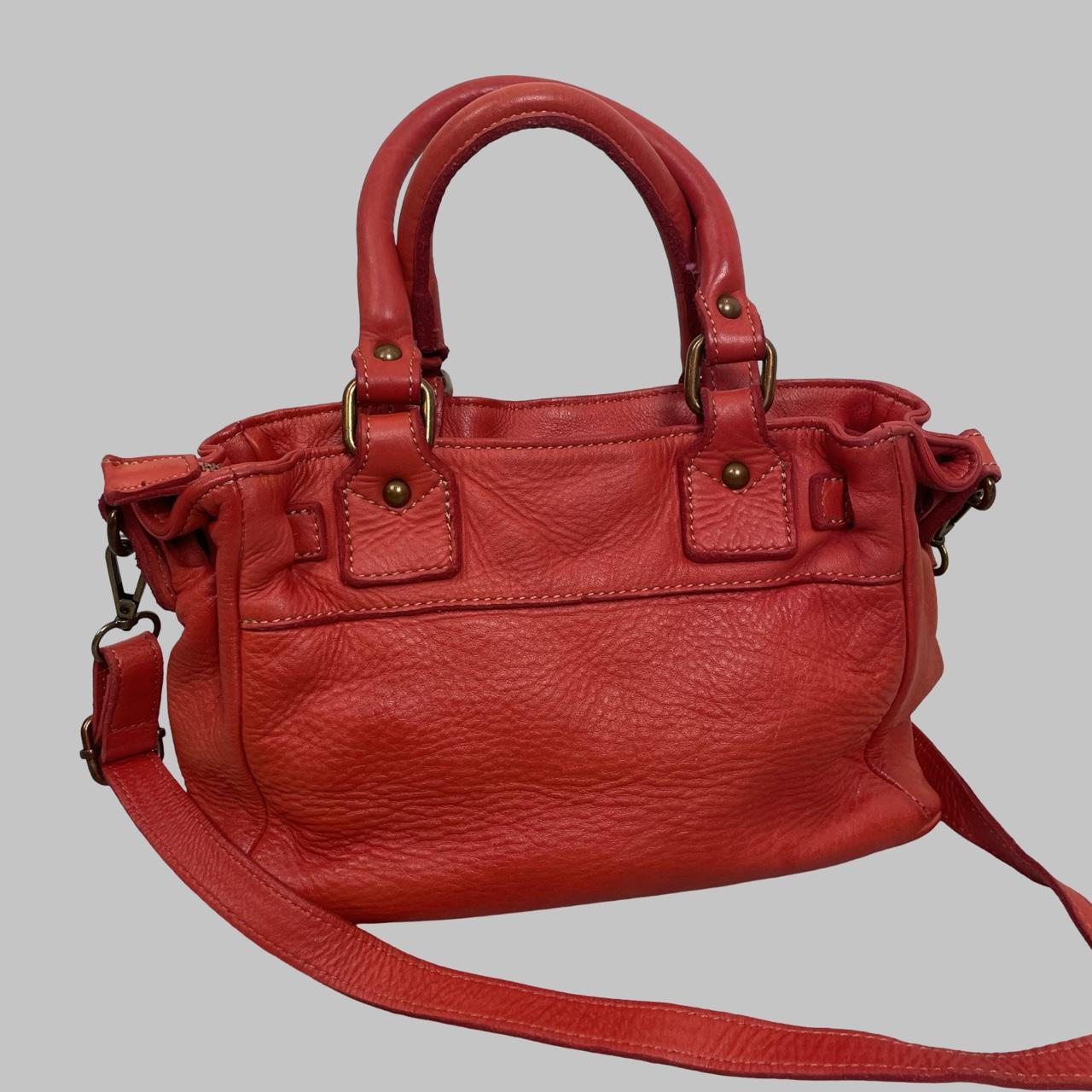 03 - Small red leather firkin bag with studs.