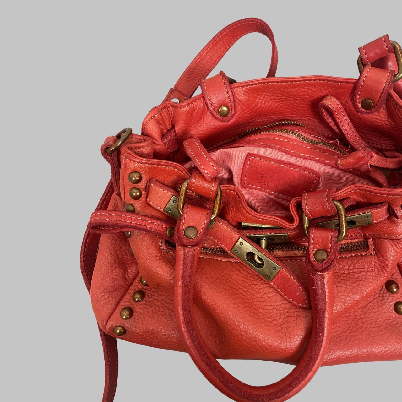 03 - Small red leather firkin bag with studs.