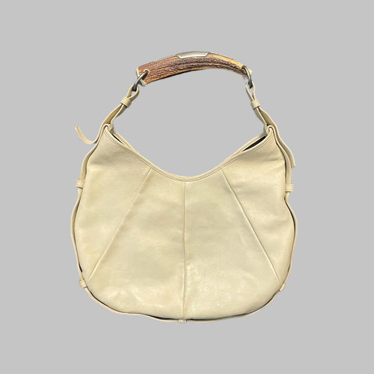 Yves Saint Laurent cream leather bag.