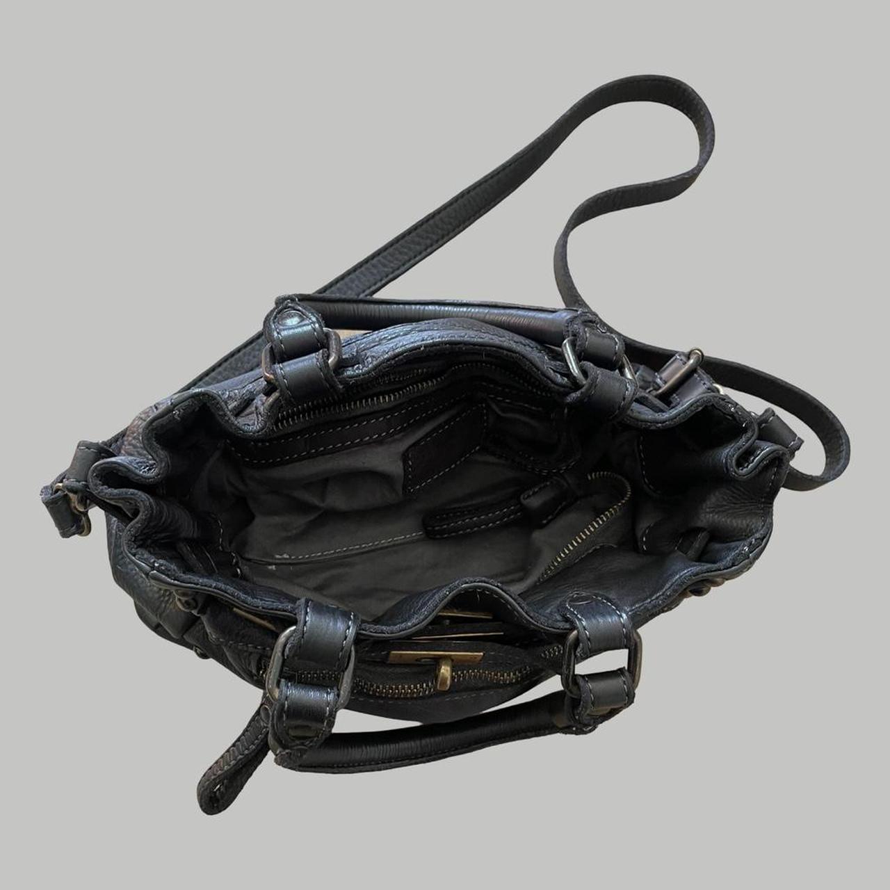 Black (small) leather firkin bag with studs.