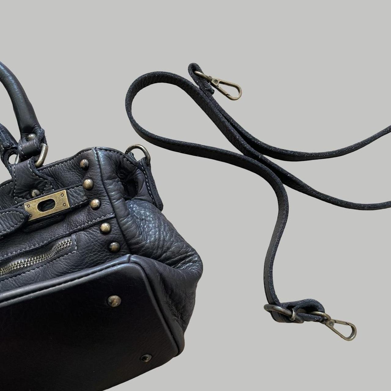 Black (small) leather firkin bag with studs.