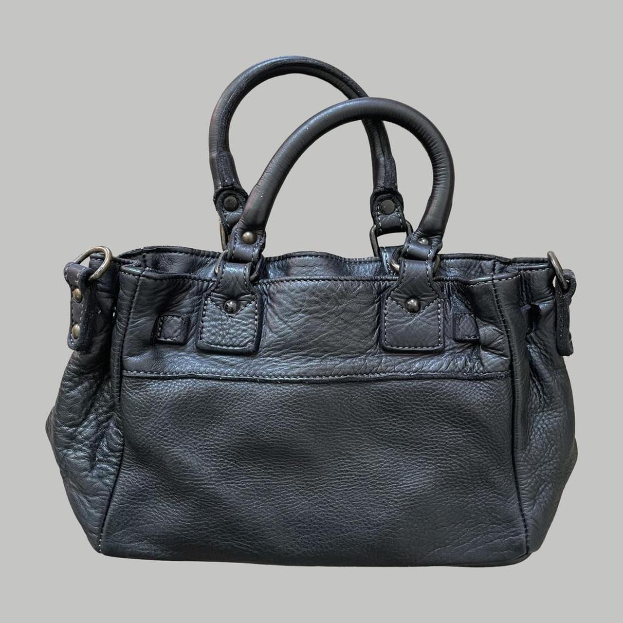 Black (small) leather firkin bag with studs.