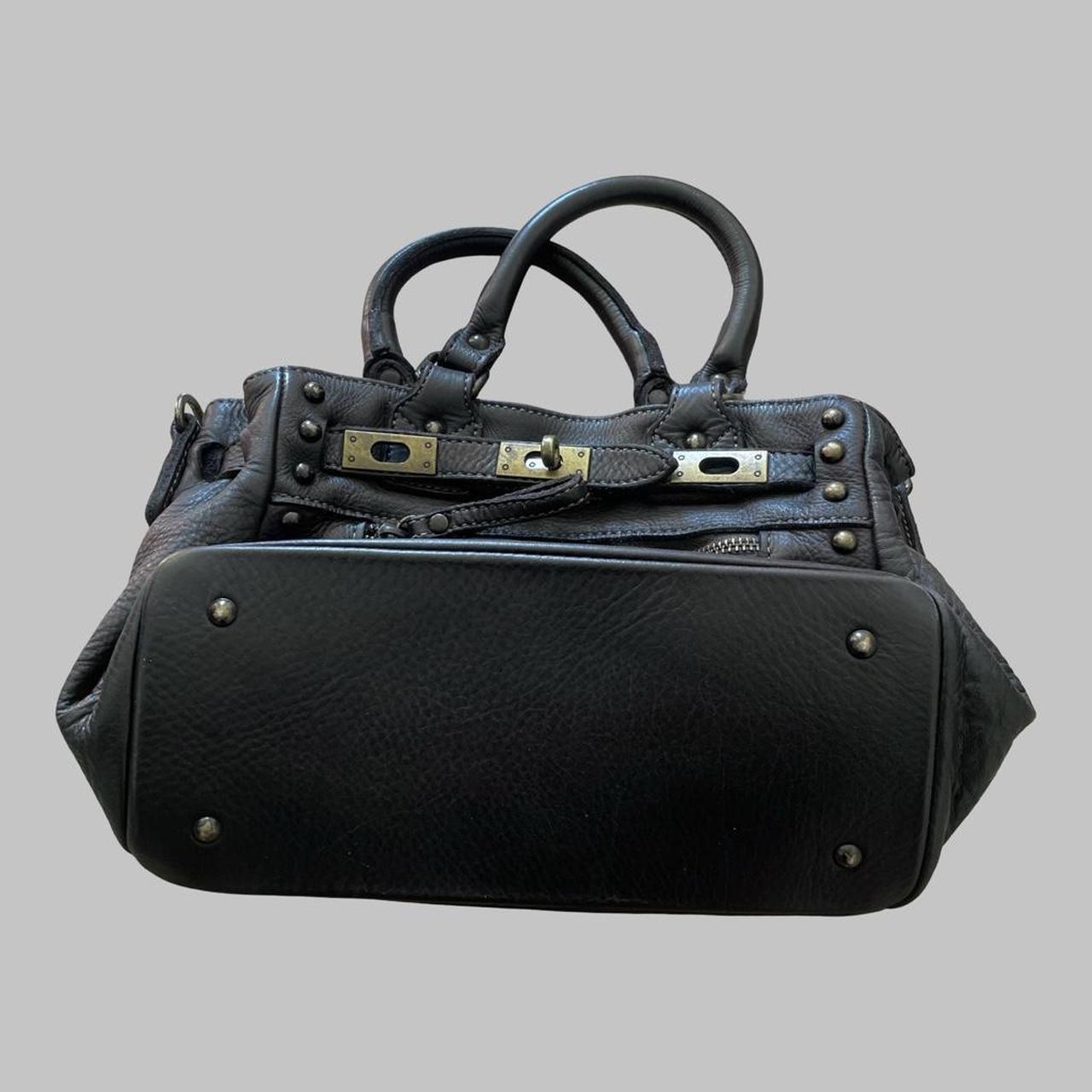 Black (small) leather firkin bag with studs.