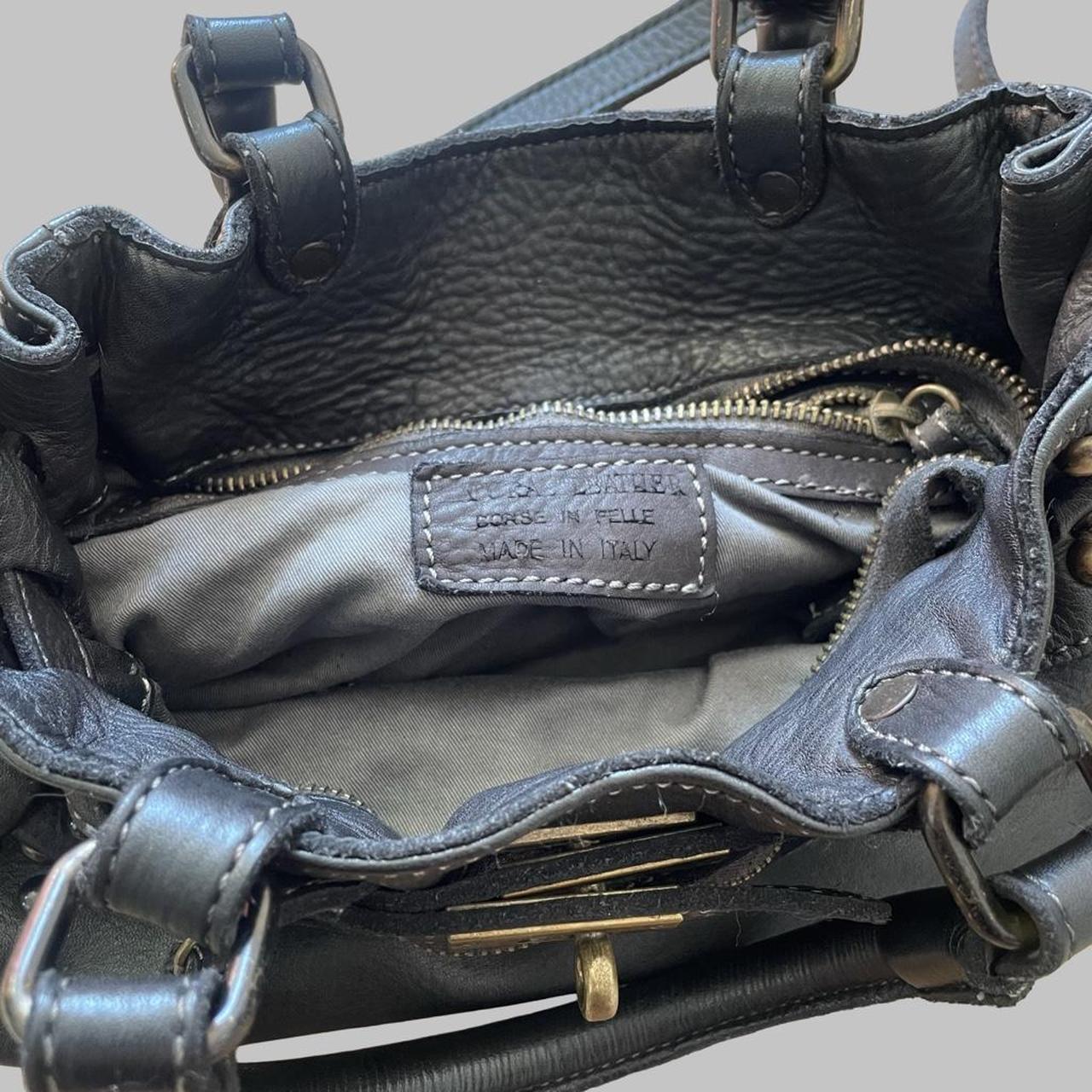 Black (small) leather firkin bag with studs.